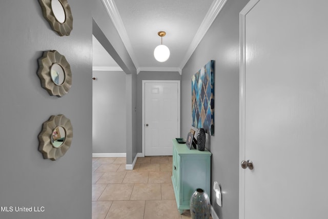 foyer entrance featuring light tile patterned flooring and ornamental molding