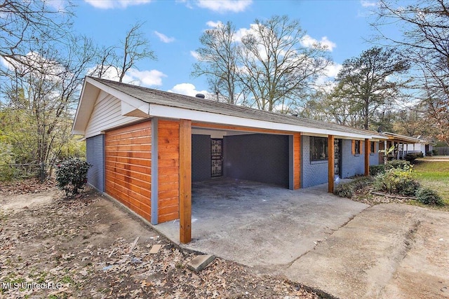 garage featuring a carport