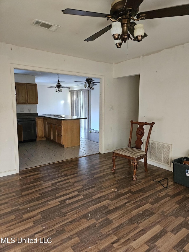 interior space with dark hardwood / wood-style floors and ceiling fan