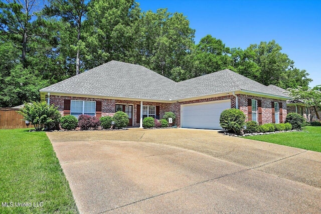 115 Victoria Pl, Brandon, MS 39042 - view of front facade with driveway, brick siding, a garage, and a shingled roof