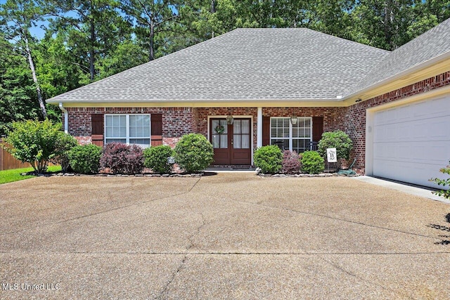115 Victoria Pl, Brandon, MS 39042 - view of front of property featuring roof with shingles, concrete driveway, brick siding, and a garage
