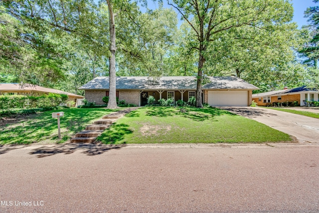 114 Fern Valley Rd, Brandon, MS 39042 - view of front of house featuring driveway, an attached garage, a front lawn, and brick siding