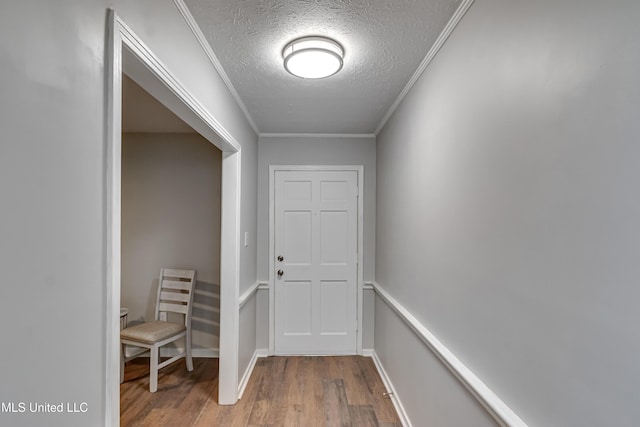 114 Fern Valley Rd, Brandon, MS 39042 - doorway with wood finished floors, a textured ceiling, and ornamental molding