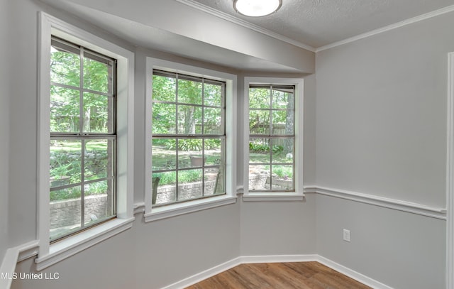 114 Fern Valley Rd, Brandon, MS 39042 - spare room featuring wood finished floors, baseboards, ornamental molding, and a textured ceiling