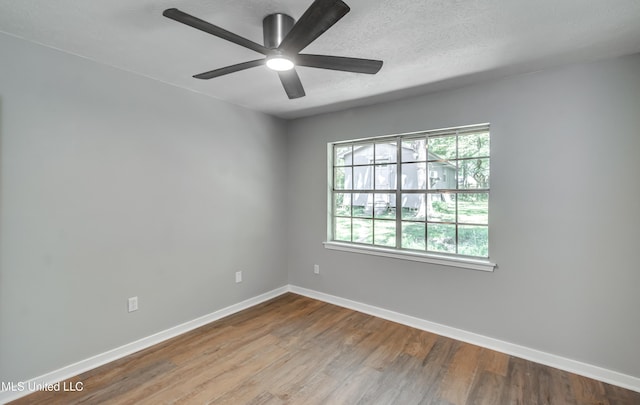 114 Fern Valley Rd, Brandon, MS 39042 - unfurnished room featuring wood finished floors, baseboards, ceiling fan, and a textured ceiling