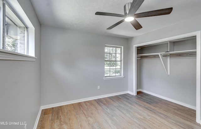114 Fern Valley Rd, Brandon, MS 39042 - unfurnished bedroom featuring wood finished floors, baseboards, a closet, and a ceiling fan