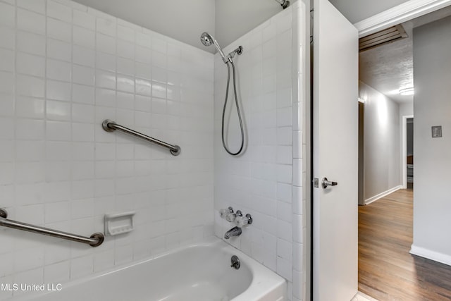 114 Fern Valley Rd, Brandon, MS 39042 - bathroom featuring shower / bathtub combination, wood finished floors, and baseboards