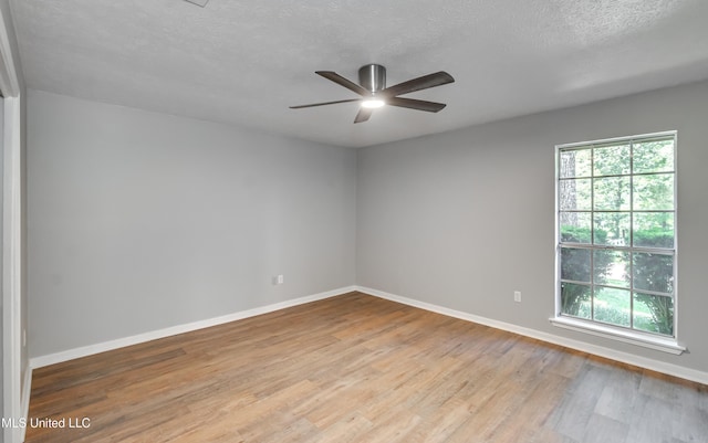 114 Fern Valley Rd, Brandon, MS 39042 - unfurnished room with a ceiling fan, baseboards, wood finished floors, and a textured ceiling