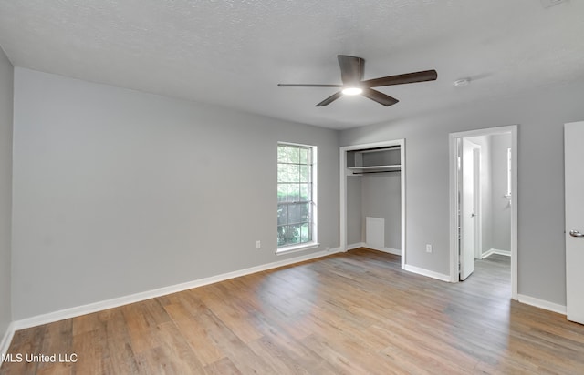114 Fern Valley Rd, Brandon, MS 39042 - unfurnished bedroom with wood finished floors, baseboards, a closet, and ceiling fan