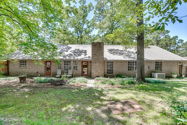 114 Fern Valley Rd, Brandon, MS 39042 - single story home featuring brick siding, a chimney, metal roof, and a front yard