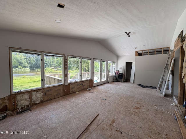 206 C St, Brandon, MS 39042 - unfurnished living room featuring lofted ceiling