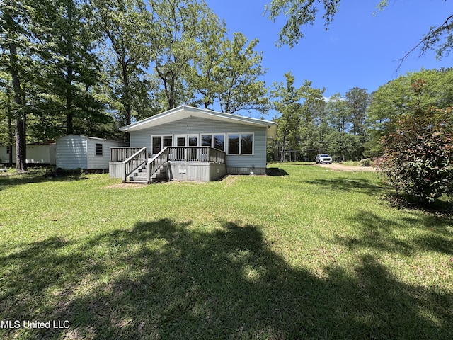 206 C St, Brandon, MS 39042 - back of house with a yard and a wooden deck