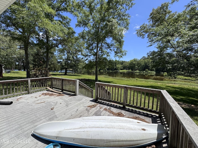 206 C St, Brandon, MS 39042 - wooden deck with a water view, a lawn, and view of wooded area