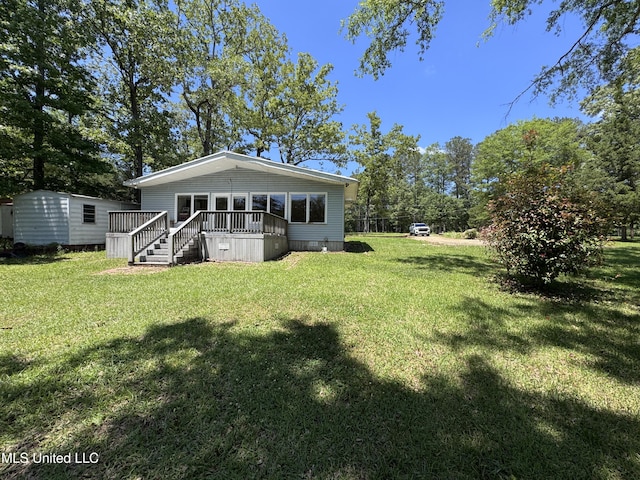 206 C St, Brandon, MS 39042 - rear view of property featuring a yard and a deck