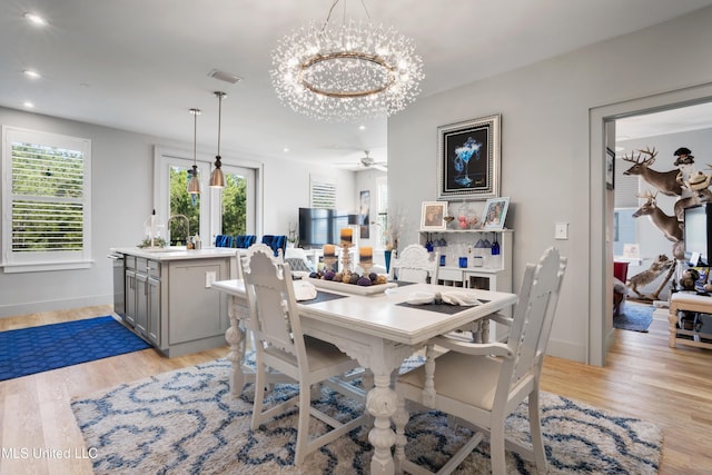 dining room with a wealth of natural light, recessed lighting, baseboards, and light wood finished floors