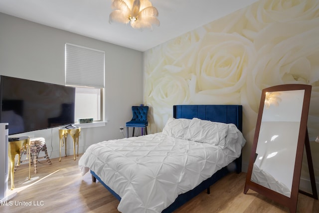 bedroom featuring wood finished floors