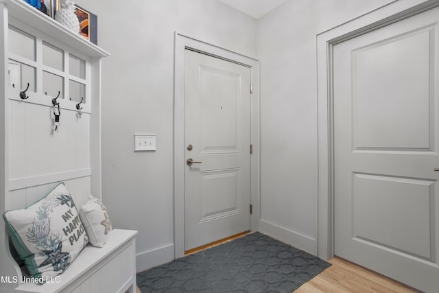 mudroom featuring baseboards and light wood-style flooring