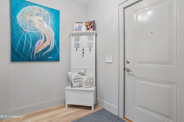 mudroom featuring light wood-type flooring and baseboards