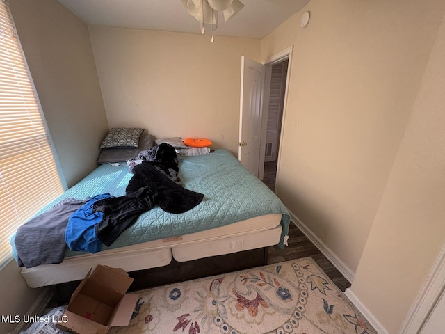 bedroom featuring dark hardwood / wood-style flooring