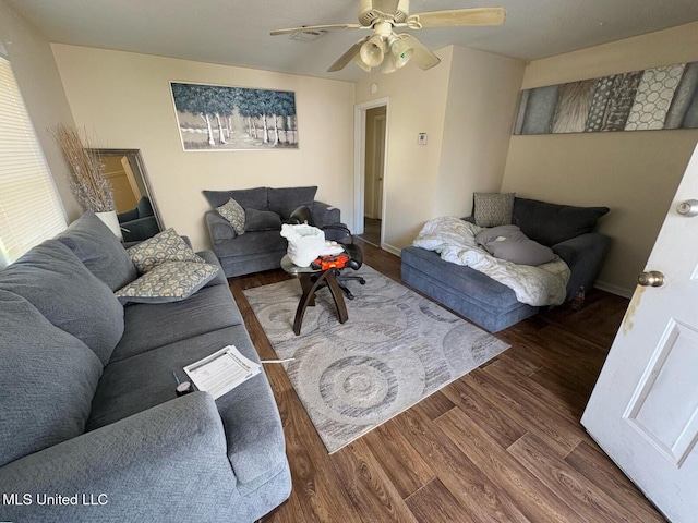 living room featuring ceiling fan and wood-type flooring