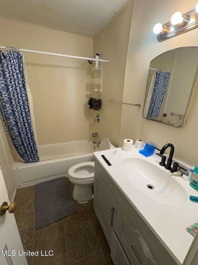 full bathroom featuring shower / bath combo, vanity, and toilet