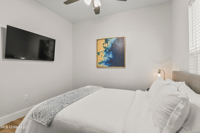 bedroom featuring wood-type flooring and ceiling fan