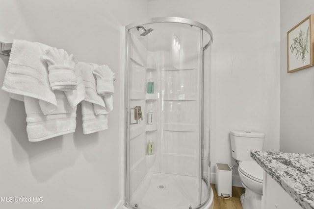 56 Oak Alley Ln, Long Beach, MS 39560 - full bathroom with a stall shower, wood finished floors, toilet, and vanity