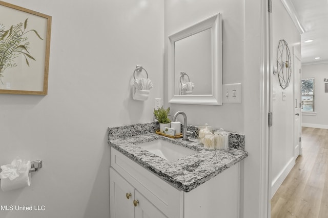 56 Oak Alley Ln, Long Beach, MS 39560 - bathroom featuring wood finished floors, baseboards, recessed lighting, and vanity