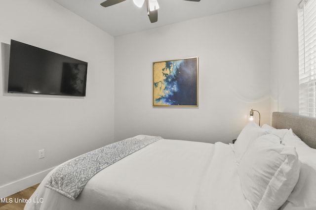 56 Oak Alley Ln, Long Beach, MS 39560 - bedroom featuring wood finished floors, baseboards, and a ceiling fan