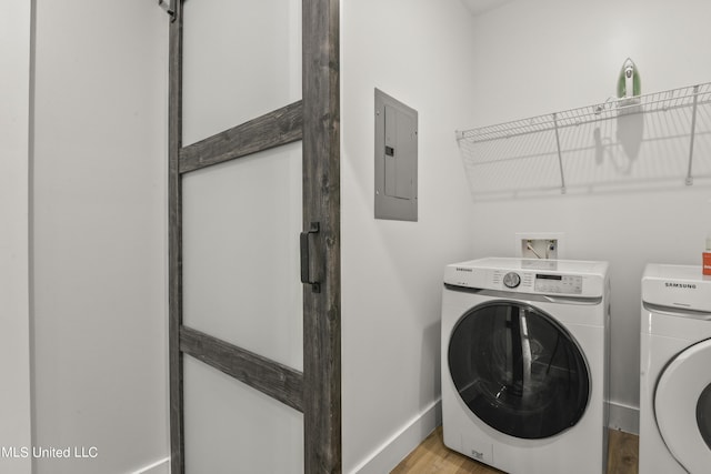 56 Oak Alley Ln, Long Beach, MS 39560 - laundry area with electric panel, independent washer and dryer, baseboards, and light wood-style flooring