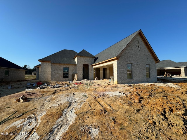 view of front of house featuring brick siding