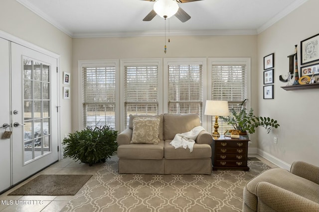 sunroom featuring ceiling fan