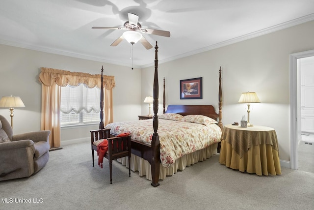 bedroom with carpet floors, ornamental molding, and ceiling fan