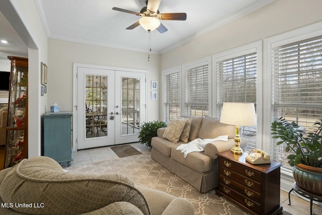 sunroom / solarium featuring ceiling fan and french doors