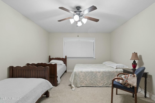 bedroom with light colored carpet and ceiling fan