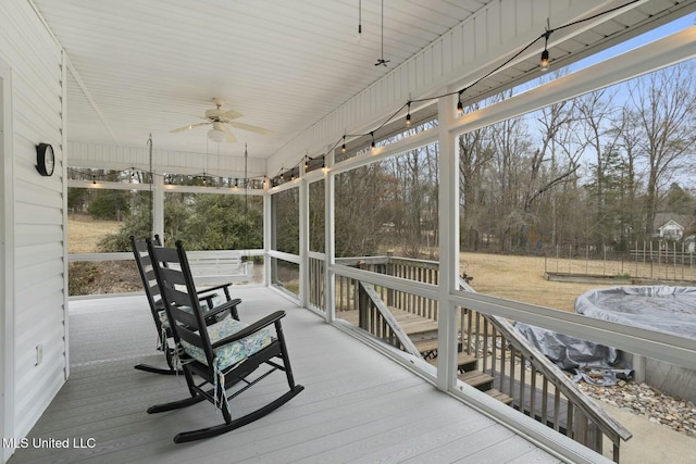 wooden deck with ceiling fan and covered porch