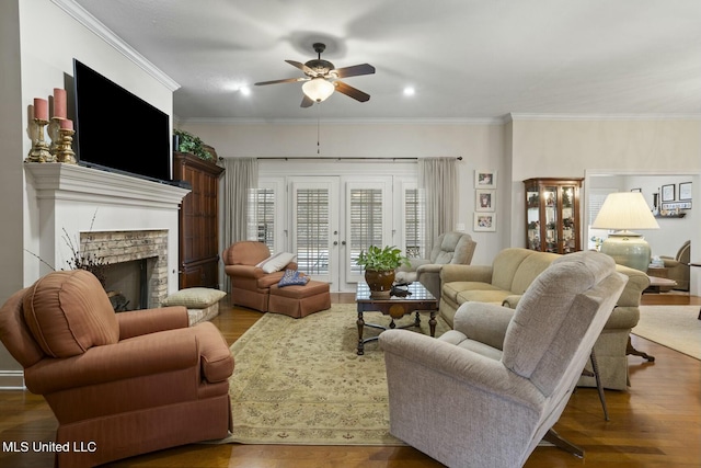 living room with crown molding, wood-type flooring, and french doors