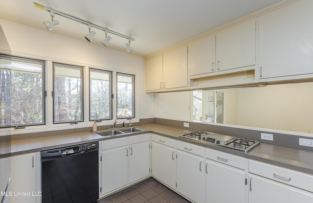 kitchen featuring stainless steel gas cooktop, dark tile patterned flooring, a sink, white cabinets, and black dishwasher