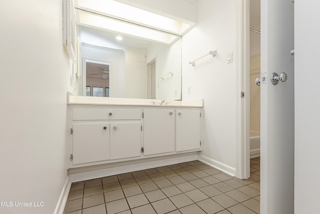 full bathroom featuring tile patterned floors, baseboards, and vanity