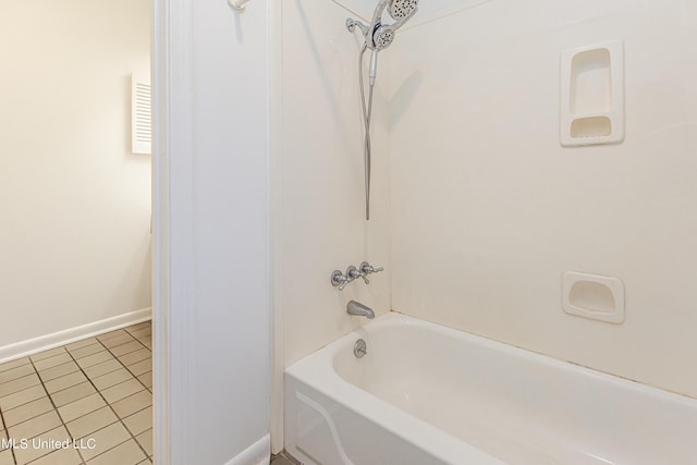 full bath featuring shower / tub combination, baseboards, and tile patterned floors