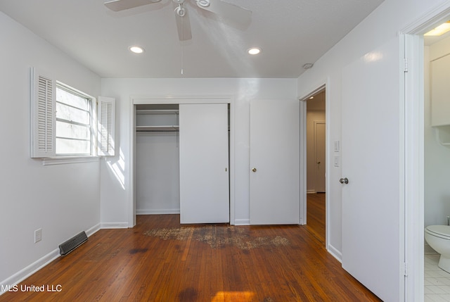 unfurnished bedroom with baseboards, a ceiling fan, wood finished floors, a closet, and recessed lighting