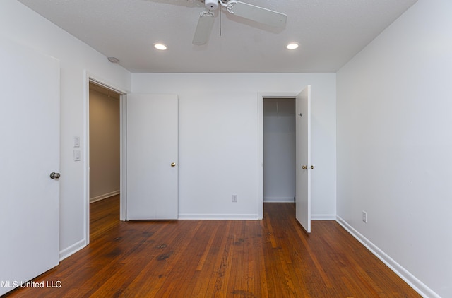 unfurnished bedroom featuring recessed lighting, a closet, hardwood / wood-style floors, a ceiling fan, and baseboards