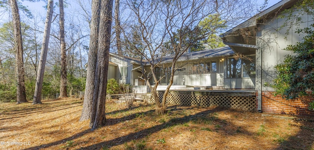 exterior space featuring a sunroom