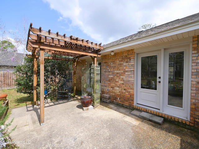 view of patio featuring fence and a pergola