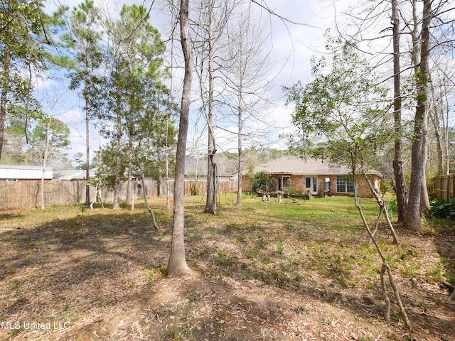 view of yard featuring fence