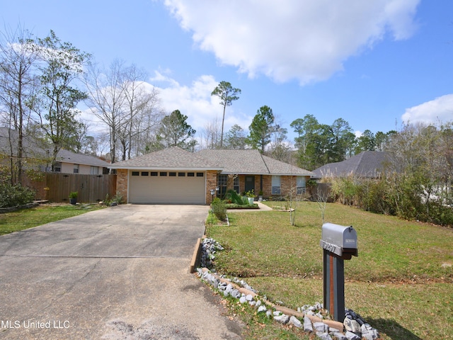 ranch-style home with brick siding, fence, a front yard, a garage, and driveway