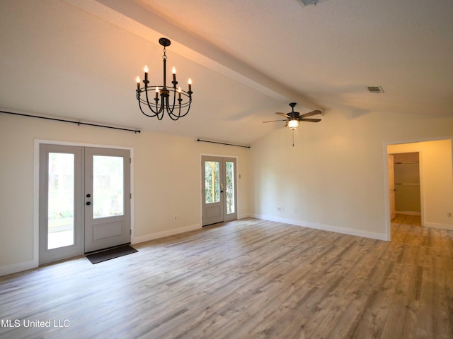 interior space featuring lofted ceiling with beams, french doors, and light wood-style flooring