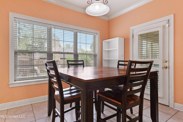 63722 N Diamondhead Dr, Diamondhead, MS 39525 - dining room with baseboards, light tile patterned flooring, and ornamental molding
