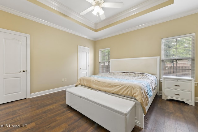 63722 N Diamondhead Dr, Diamondhead, MS 39525 - bedroom featuring a tray ceiling, multiple windows, crown molding, dark wood-style floors, and baseboards