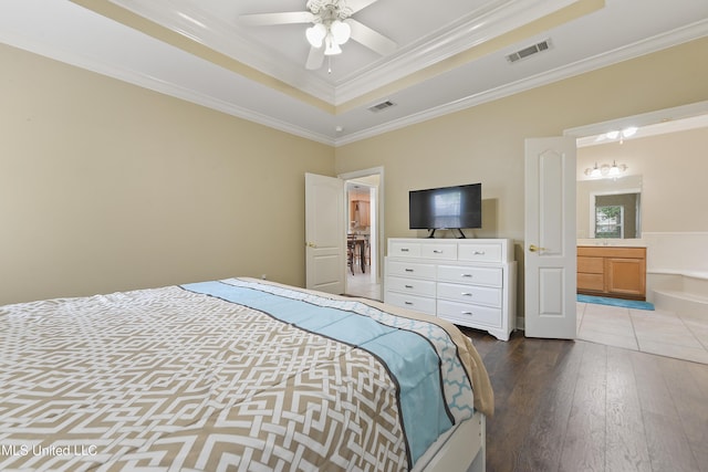 63722 N Diamondhead Dr, Diamondhead, MS 39525 - bedroom with a tray ceiling, ornamental molding, hardwood / wood-style floors, and connected bathroom
